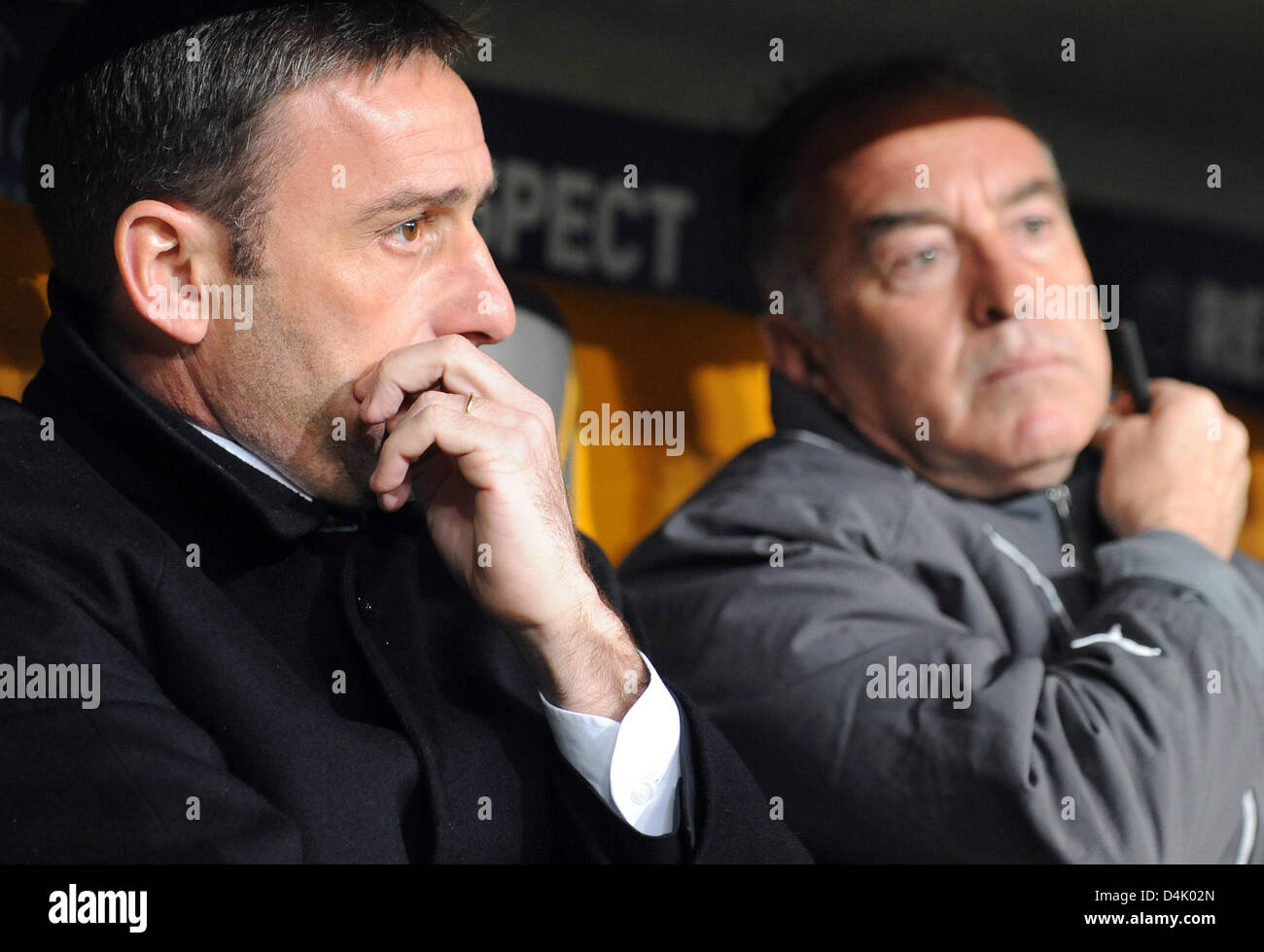 Sporting?s head coach Paulo Bento (L) and assistant coach Carlos Pereira sit on the bench prior to the second round second leg game FC Bayern Munich vs Sporting CP at Allianz-Arena stadium in Munich, Germany, 10 March 2009. Bayern Munich defeated Sporting 7-1. Photo: Andreas Gebert Stock Photo