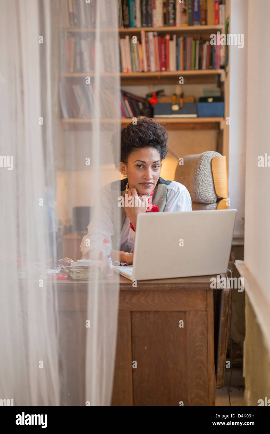 Businesswoman working on laptop Stock Photo