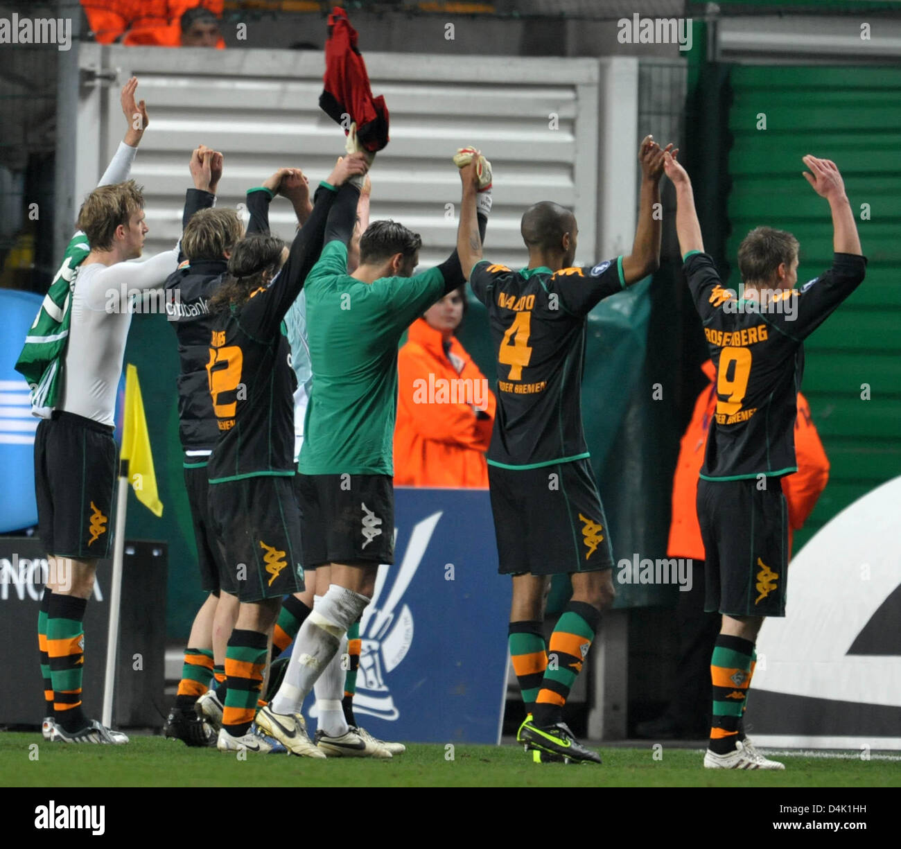 Werder Bremen players thank their fans who have traveled with them for the UEFA Cup last sixteen return match against AS Saint-Etienne at Stadium Geoffroy Guichard in Saint Etienne, France, 18 March 2009. The game ended in a 2-2 tie with Bremen qualifying for the quarter-finals. Photo: Carmen Jaspersen Stock Photo