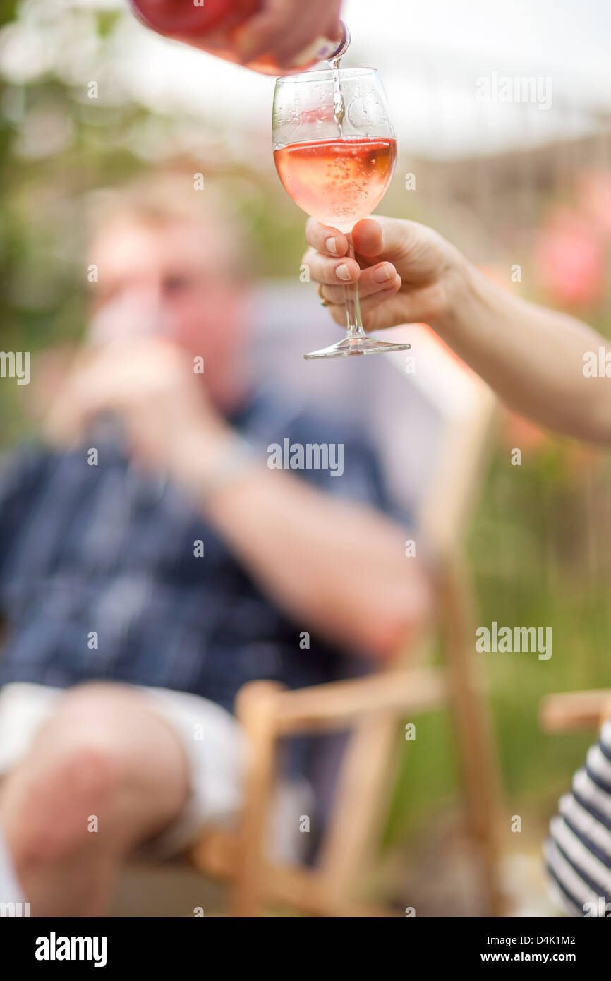 Woman pouring glass of wine outdoors Stock Photo - Alamy