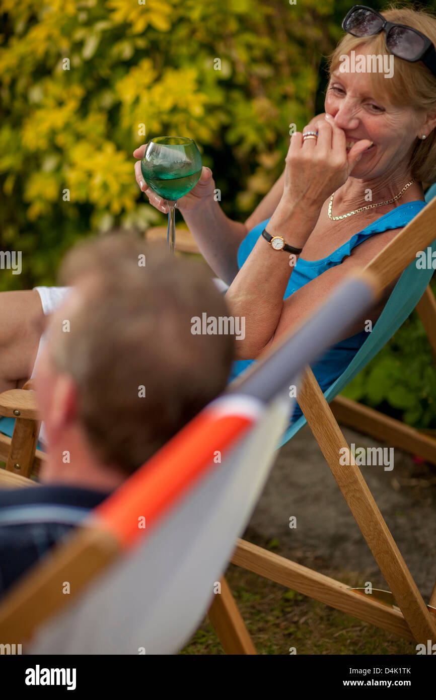 Couple having wine together outdoors Stock Photo