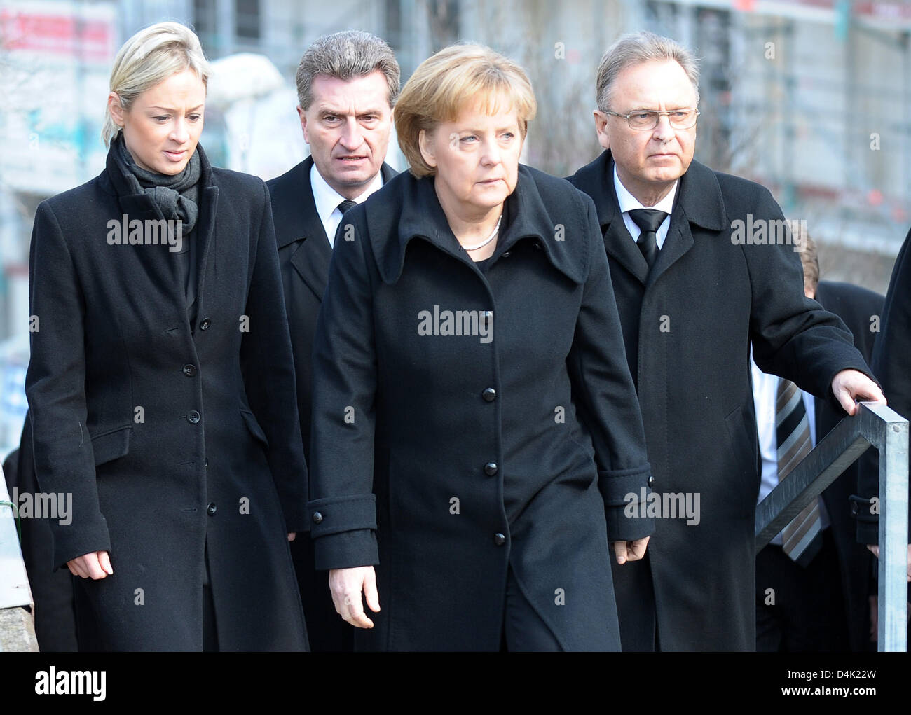 German Chancellor Angela Merkel (C), the Prime Minister of Baden-Wuertemmberg Baden-Württemberg, Guenther Oettinger (2-L) his partner Friederike Beyer (L) and the President of the Federal Constitutional Court, Hans-Juergen Papier (R) arrive for the official memorial service at St. Karl Borromaeus Church in Winnenden, Germany, 21 March 2009. Mourners commemorated the 15 vicitims kil Stock Photo