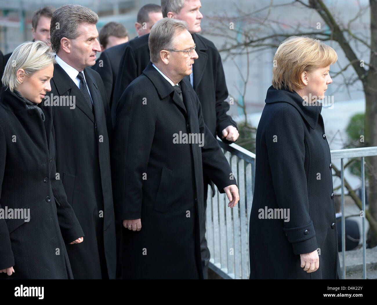 German Chancellor Angela Merkel (R), the Prime Minister of Baden-Wuertemmberg Baden-Württemberg, Guenther Oettinger (2-L) his partner Friederike Beyer (L) and the President of the Federal Constitutional Court, Hans-Juergen Papier (2-R) arrive for the official memorial service at St. Karl Borromaeus Church in Winnenden, Germany, 21 March 2009. Mourners commemorated the 15 vicitims k Stock Photo