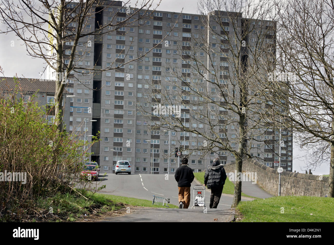 Asylum seekers make there way home to their temporary accommodation in the Sighthill area of Glasgow, Scotland Stock Photo
