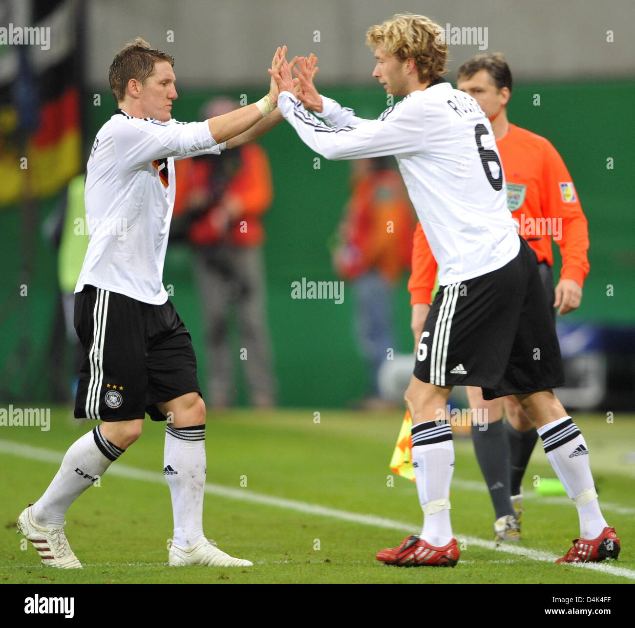 Bastian schweinsteiger gives simon rolfes hi-res stock photography and  images - Alamy