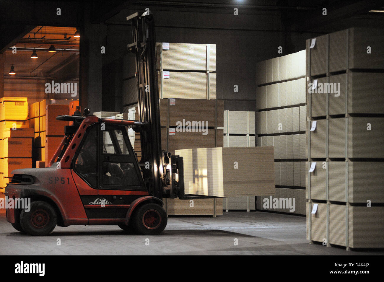 A Forklift Transports Chipboards In A Warehouse Of Pfleiderer Ag