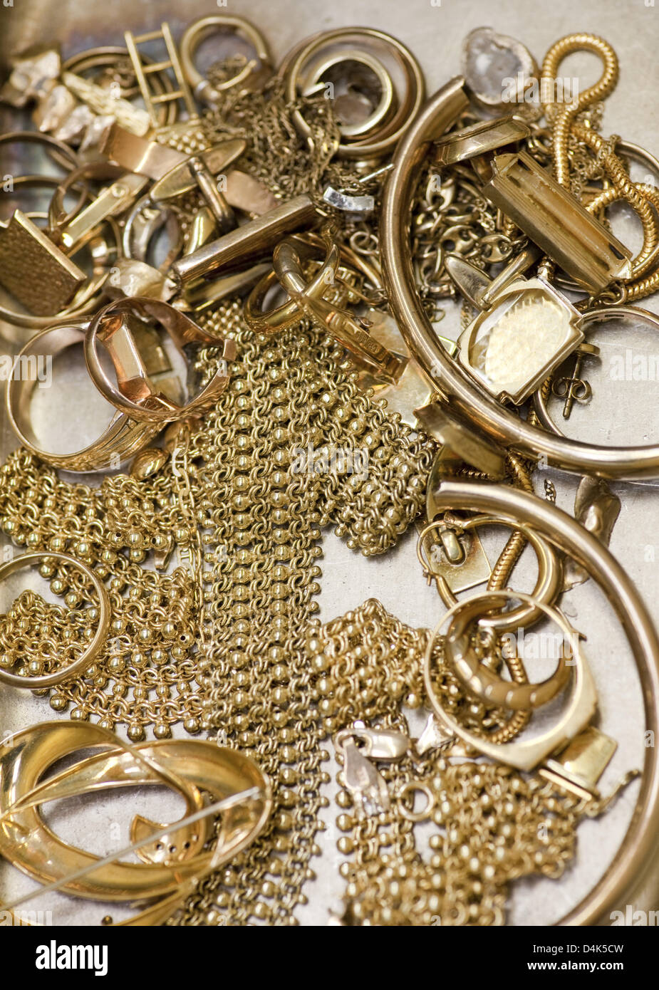 The picture shows gold jewellery that is about to be melted down in a