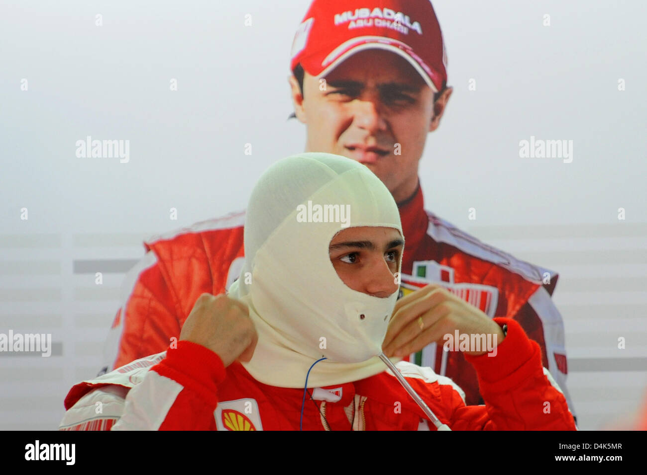 Brazilian Formula One driver Felipe Massa of Ferrari adjusts his fire retardant hood before the first training at Sepang circuit on the outskirts of Kuala Lumpur, Malaysia, 03 April 2009. Rosberg finished first during the training. The 2009 Formula One Malaysian Grand Prix will take place on Sunday 05 April. Photo: Peter Steffen Stock Photo