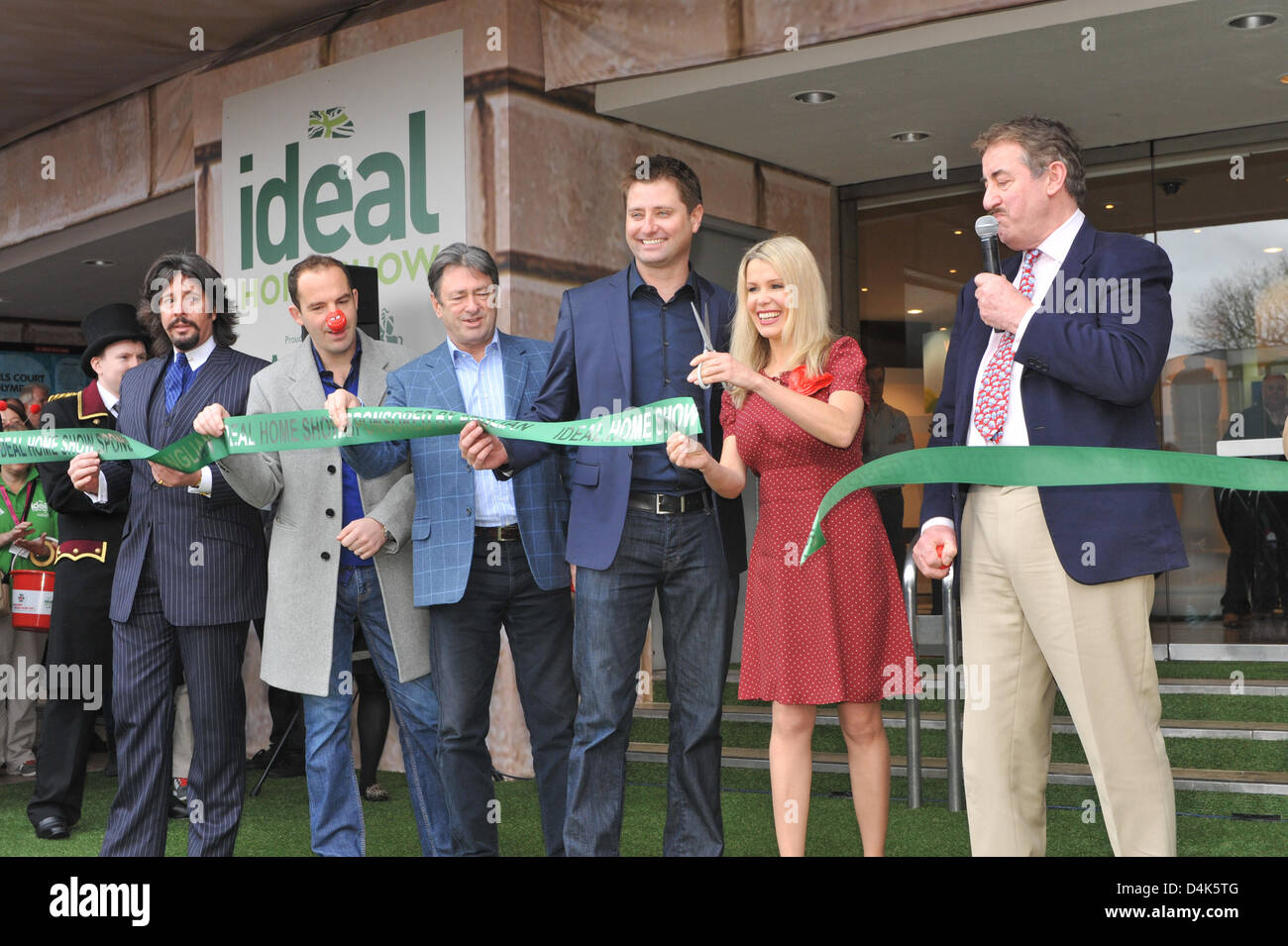 Earls Court, London, UK. 15th March 2013. Melinda Messenger cuts the tape to open the Ideal Home Show. The Ideal Home Show at Earls Court is opened by celebrities, Laurence Llewelyn-Bowen, Martin Lewis, Alan Titchmarsh, George Clarke, Melinda Messenger and John Challis.  Credit:  Matthew Chattle / Alamy Live News Stock Photo