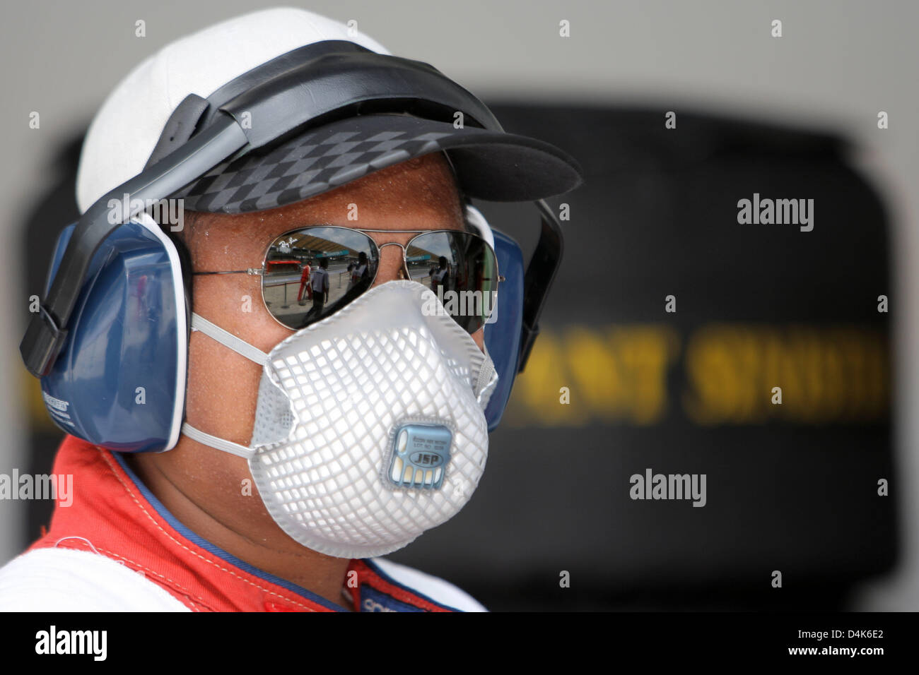 An official watches the thrid practice session at Sepang circuit near Kuala Lumpur, Malaysia, 04 April 2009. The 2009 Formula 1 Malaysian Grand Prix will take place on 05 April. Photo: Jens Buettner Stock Photo