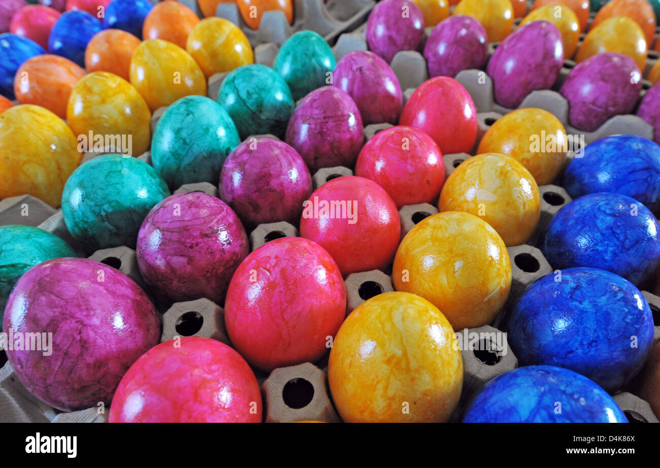 Dyed egges pictured in Wandersleben, Germany, 02 April 2009. Some 20 million dyed eggs will be delivered this year?s Easter season, up to 40 million a year plus 550 million fresh eggs sold Germany-wide. Photo: Martin Schutt Stock Photo