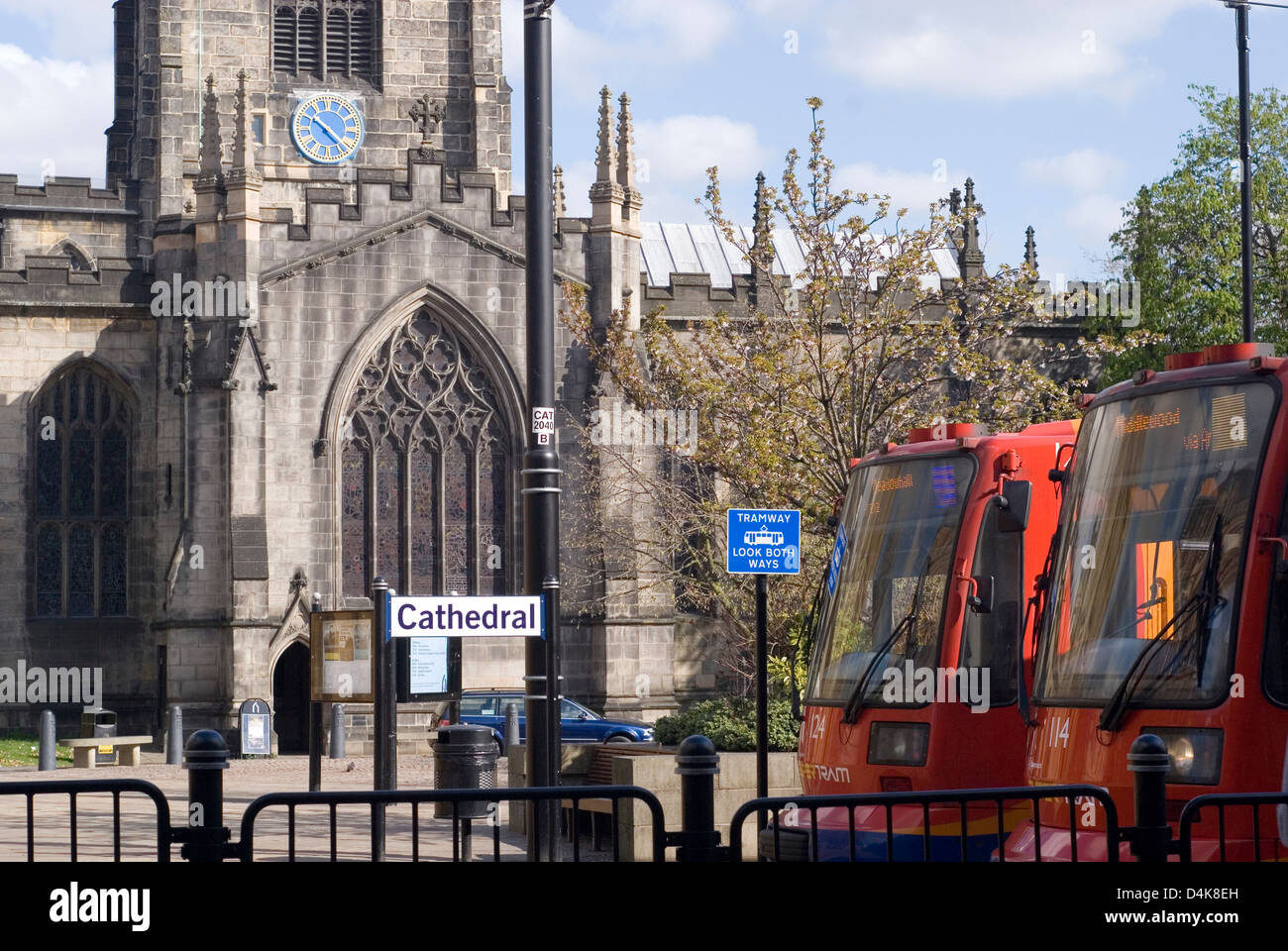 Two trams stopped outside Sheffield Cathedral, Cathedral tram stop, Sheffield, UK Stock Photo
