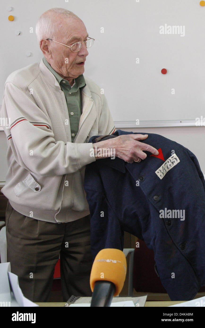 Hans Steinhage, a survivor of the concentration camp Sachsenhausen, points at the prisoner?s number on his prisoner?s winter jacket in Oranienburg, Germany, 17 April 2009. The 89-year-old was a political prisoner in Sachsenhausen from 1940 to 1945. After 64 years he now returned from the Netherlands to the place of his sufferings and handed over his prisoner?s clothes with a winter Stock Photo
