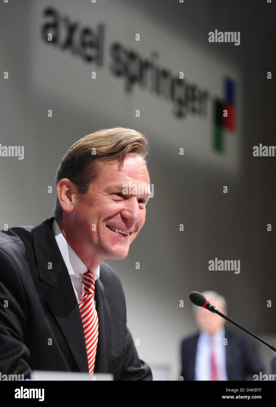 Axel Springer group CEO Mathias Doepfner smiles on the podium during ...
