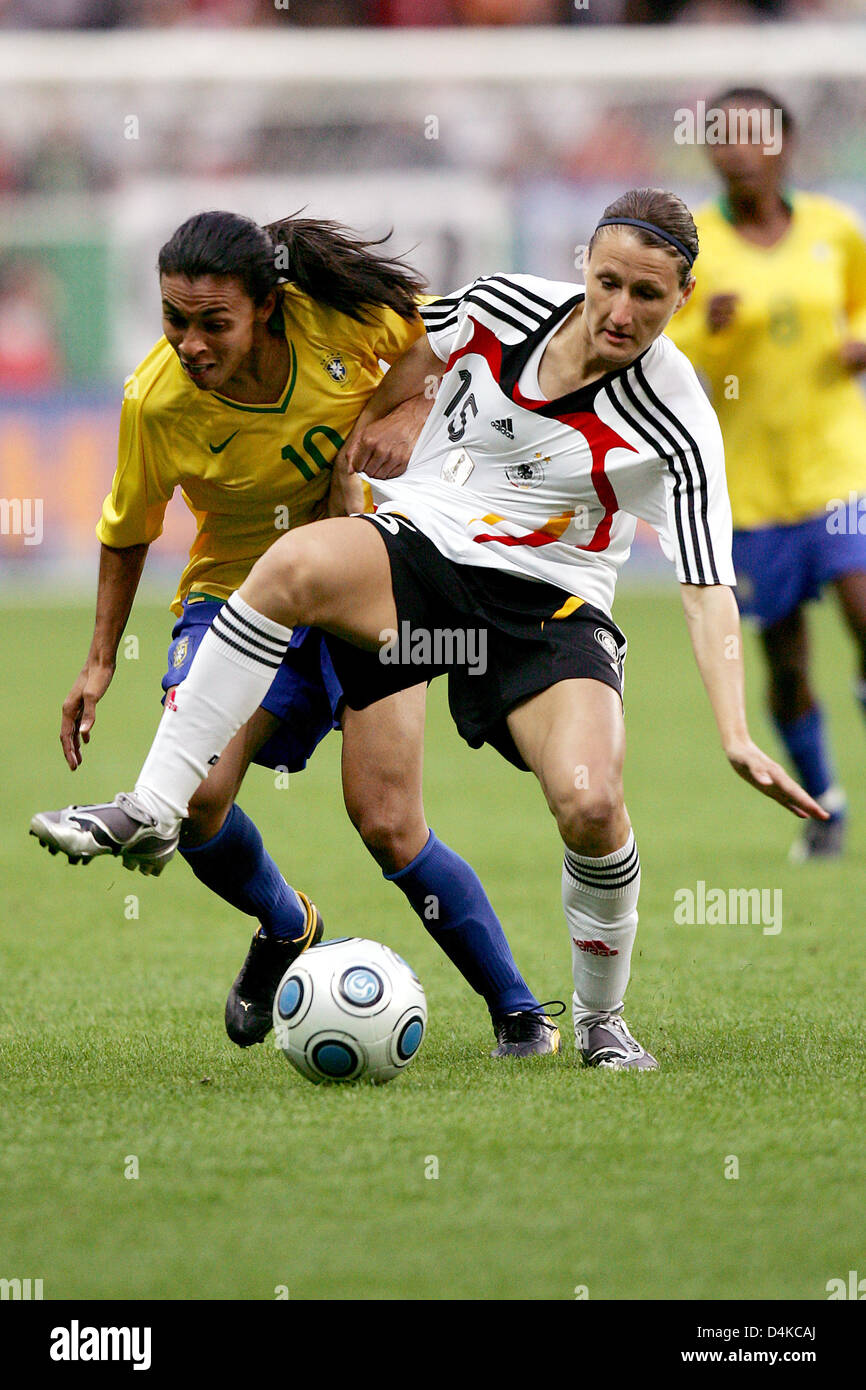 Germany?s Sonja Fuss (R) and Brazil?s Marta struggle for the ball during the friendly match Germany vs Brazil at Commerzbank Arena stadium in Frankfurt Main, Germany, 22 April 2009. The match that established a new European visitors record for women?s soccer with 44,825 fans ended in a 1-1 draw. Photo: Marius Becker Stock Photo