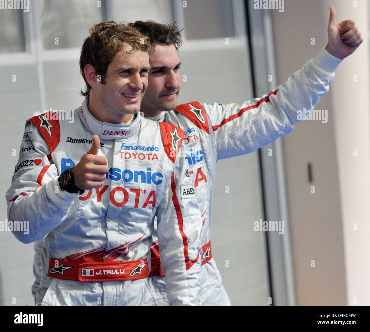 Toyota teammates Italian Formula One driver Jarno Trulli (L) and 