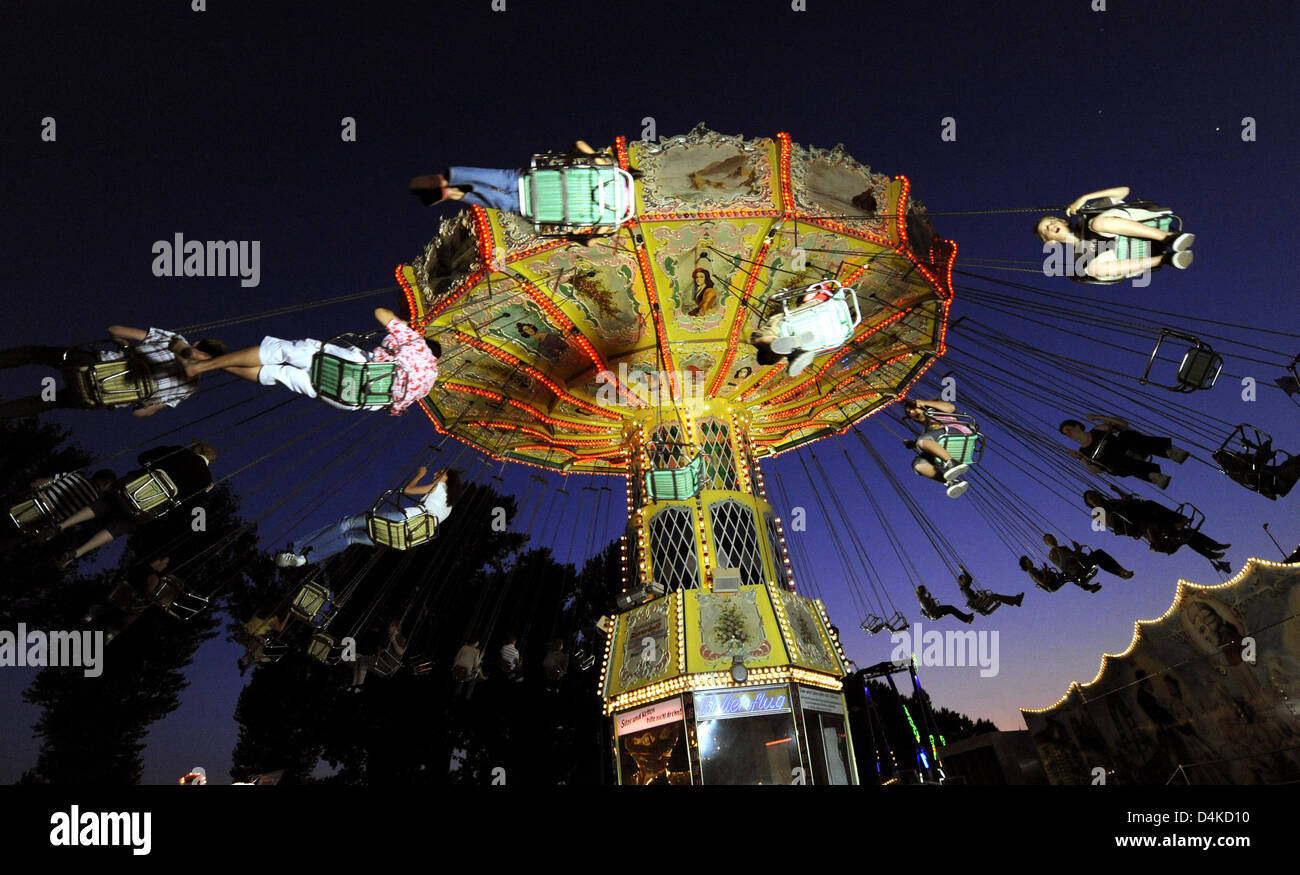 Shooting Up Ride People ride chairoplane at the 480th shooting march in Hanover, Germany ...