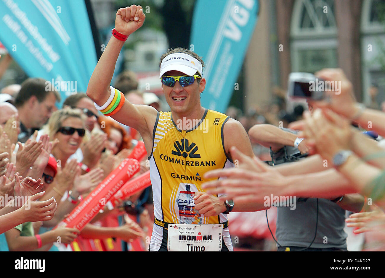 Germany?s Timo Bracht crosses the finish line first at the Ironman ...