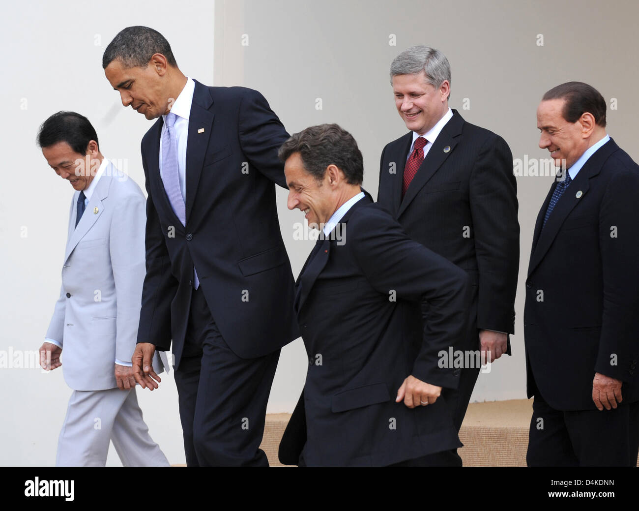 The Heads of Government of Japan, Taro Aso (L-R), of USA, Barack Obama, of France, Nicolas Sarkozy, of Canada, Stephen Harper, and of Italy, Silvio Berlusconi, leave after a family photograph in L?Aquila, Italy, 08 July 2009. This year?s G8 Summit will take place in L?Aquila from 08 til 10 July 2009. Photo: PEER GRIMM Stock Photo