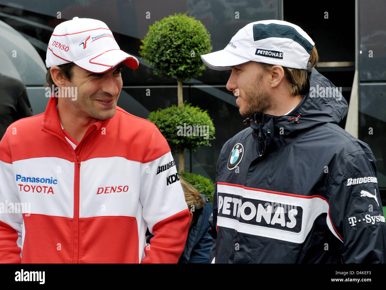 German Formula One driver Nick Heidfeld (R) of BMW Sauber and German Formula One driver Timo Glock (L) of Toyota Racing chat in the paddock prior to the Grand Prix of Germany at the Nuerburgring in Nuerburg, Germany, 12 July 2009. Photo: Carmen Jaspersen Stock Photo