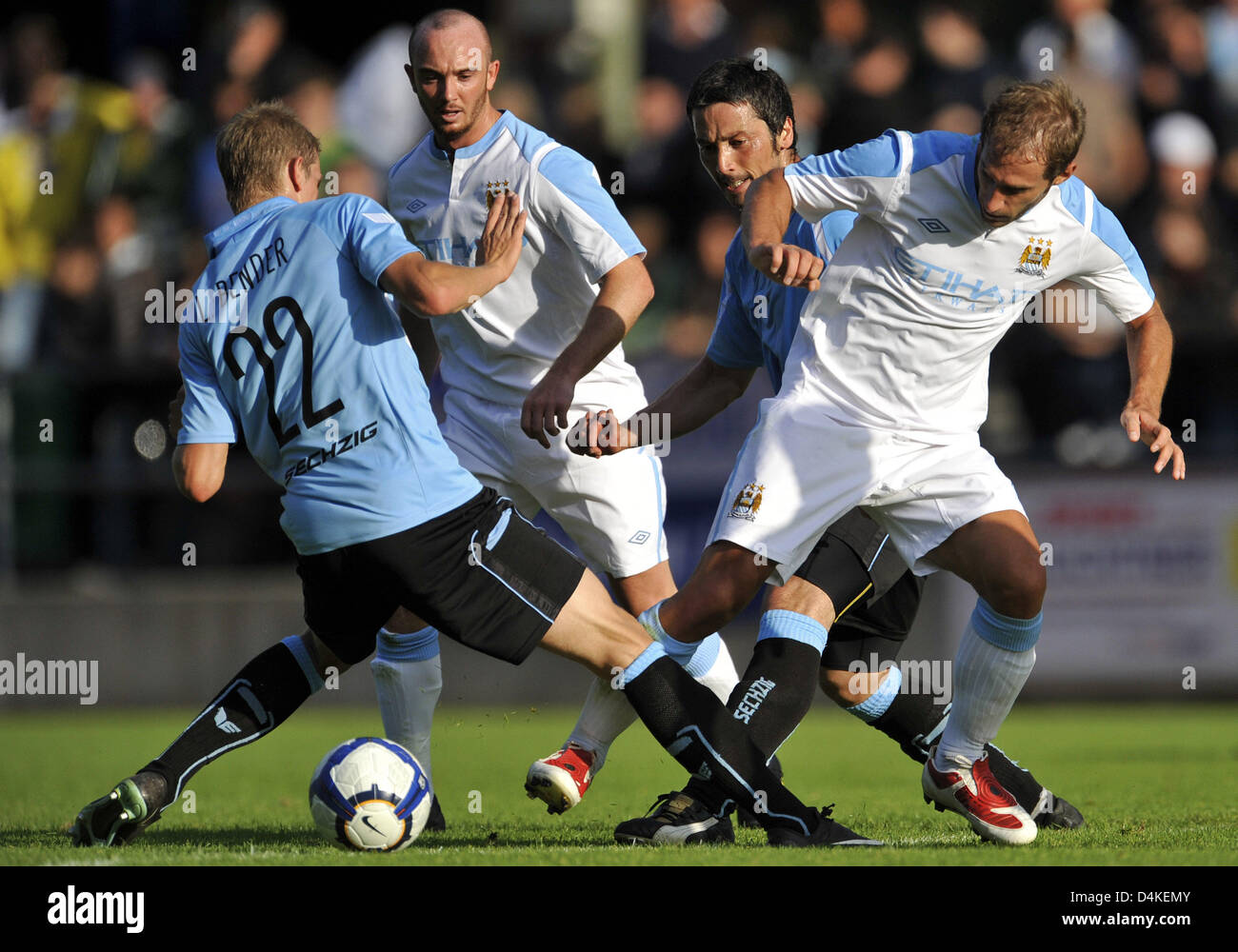 Bayern Munich's Willy Sagnol (R) and 1860 Munich's Lars Bender (L) shown in  action during the soccer friendly FC Bayern Munich vs TSV 1860 Munich at  Allianz-Arena in Munich, Germany, 26 January