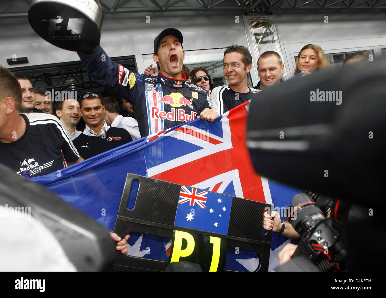 Australian Formula One driver Mark Webber of Red Bull Racing celebrates ...