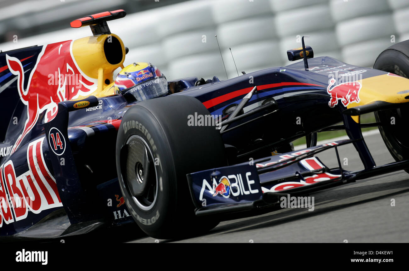 Australian Formula One driver Mark Webber of Red Bull Racing steers his ...