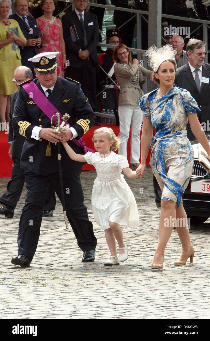 Belgian Prince Laurent (L) is pictured with Princess Claire (R) and her  daughter Princess Louise on the podium during the military parade on the  occasion of Belgium?s National Day in Brussels, Belgium