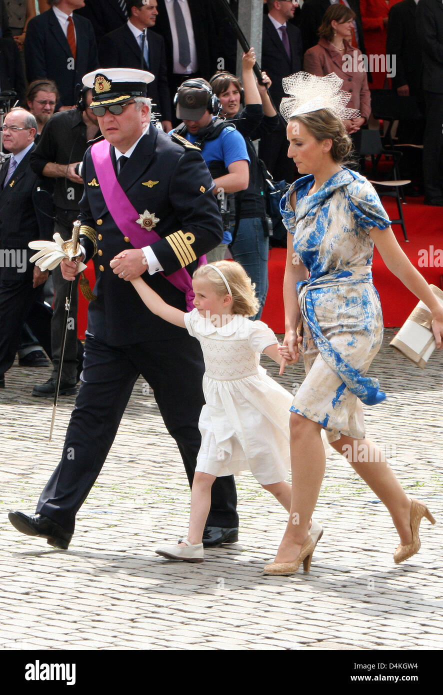 Belgian Prince Laurent (L) is pictured with Princess Claire (R) and her  daughter Princess Louise on the podium during the military parade on the  occasion of Belgium?s National Day in Brussels, Belgium