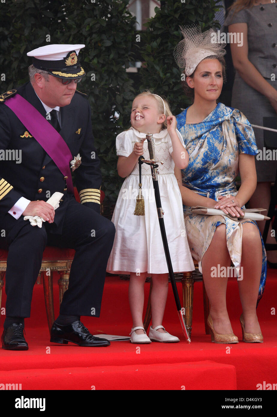 Belgian Prince Laurent (L) is pictured with Princess Claire (R) and her  daughter Princess Louise on the podium during the military parade on the  occasion of Belgium?s National Day in Brussels, Belgium