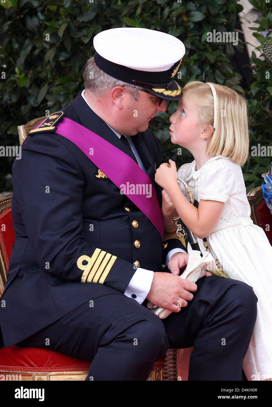 Belgian Prince Laurent (L) is pictured with Princess Claire (R) and her  daughter Princess Louise on the podium during the military parade on the  occasion of Belgium?s National Day in Brussels, Belgium