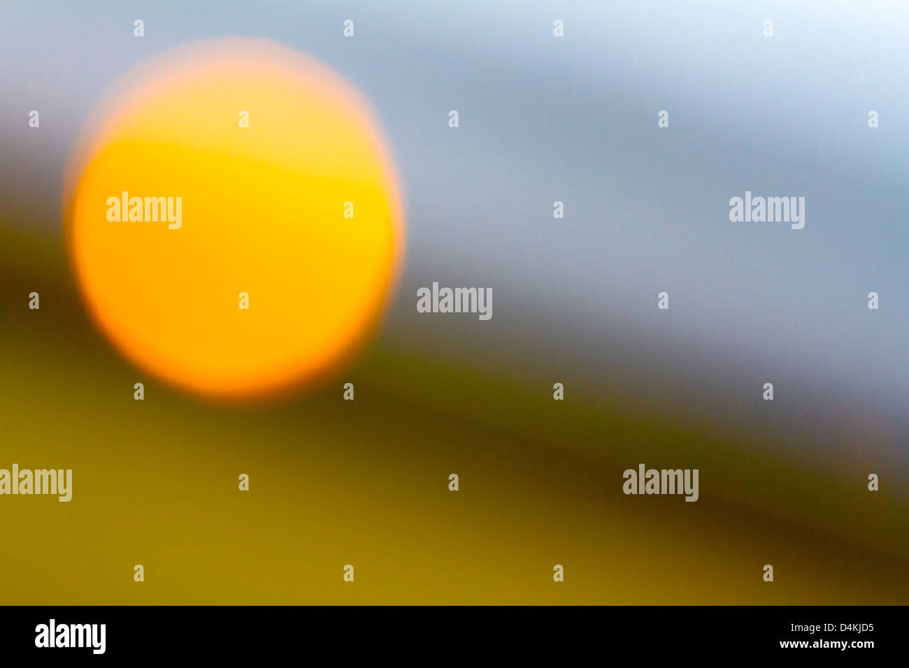Abstract photo of a sun-like object on a sloping horizon Stock Photo