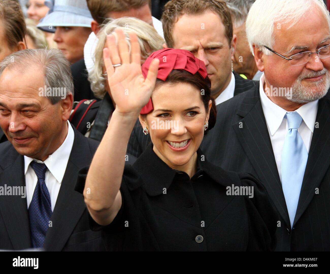 Danish Crown Princess Mary waves to the people next to Schleswig