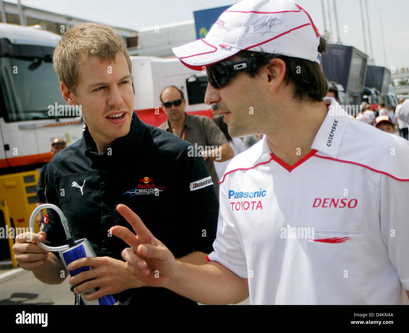 German Formula One driver Sebastian Vettel (L) of Red Bull Racing and German Formula One driver Timo Glock of Toyota Racing are pictured in the paddock prior to the start of the Formula One Grand Prix of Spain at Circuit de Catalunya in Montmelo near Barcelona, Spain, 10 May 2009. Photo: Jan Woitas Stock Photo