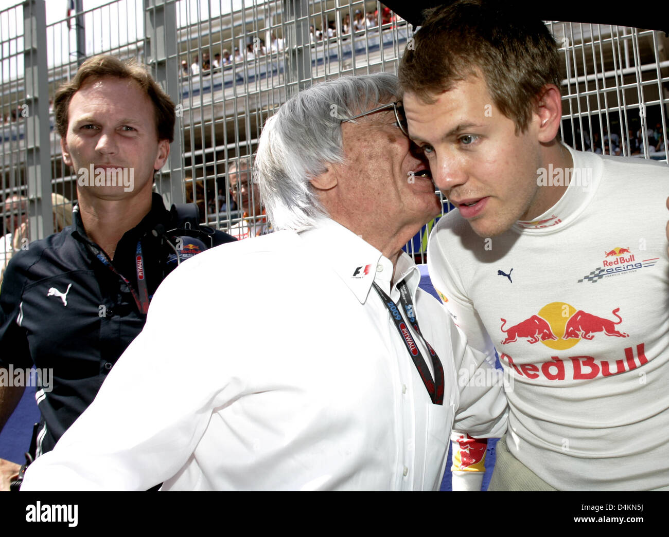 German Formula One driver Sebastian Vettel of Red Bull Racing (R), Bernie Ecclestone (C) and British Christian Horner, team principal of Red Bull Racing (L), are pictured in the grid prior to the start of the Formula One Grand Prix of Spain at Circuit de Catalunya in Montmelo near Barcelona, Spain, 10 May 2009. Photo: Felix Heyder Stock Photo