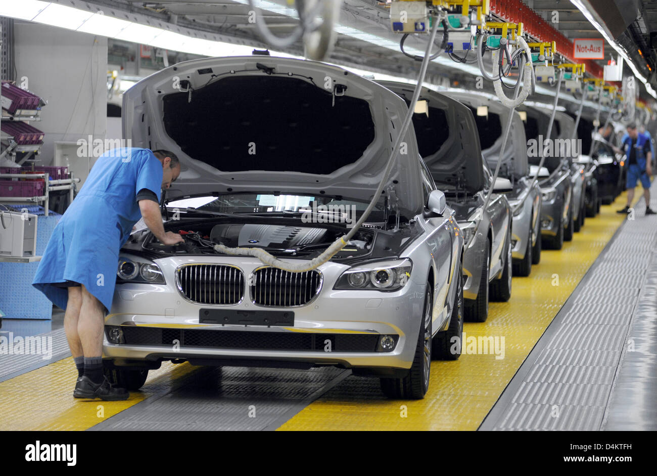 A staff member works at BMW 7 Series in the BMW factory in Dingolfing