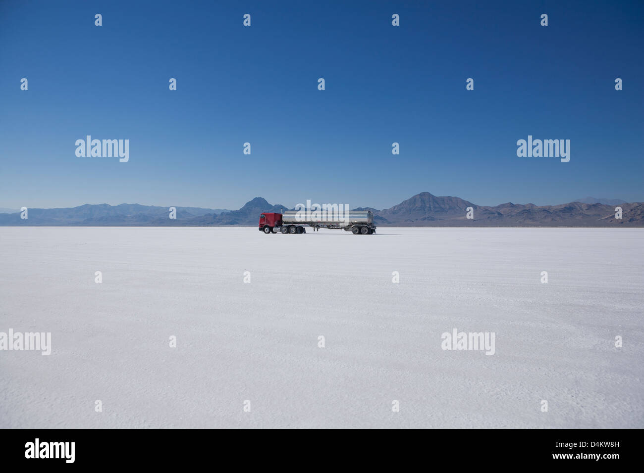 Truck driving in desert landscape Stock Photo