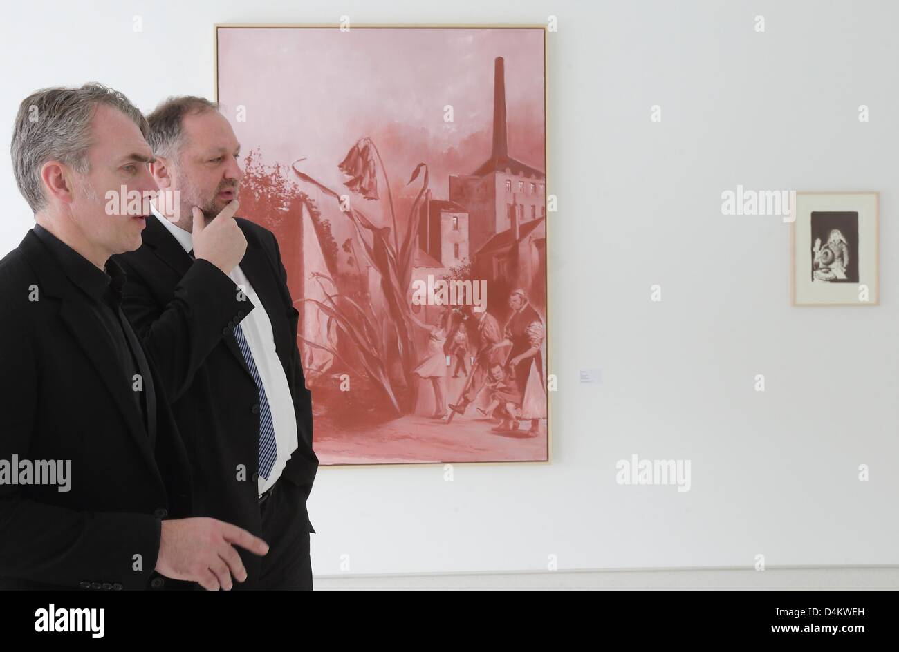 German painter Neo Rauch (L) and mayor of  Aschersleben Andreas Michelmann walk through the graphics exhibition Neo Rauch in Aschersleben, Germany, 15 March 2013. The second exhibition at Neo Rauch Graphic Foundation will open its doors on 17 September 2013. Rauch spent his childhood and youth in Aschersleben. Photo: JENS WOLF Stock Photo