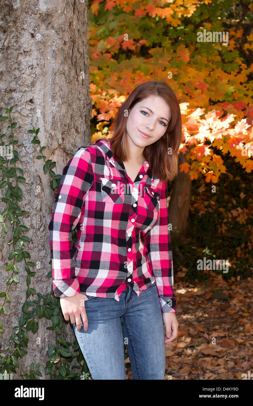 Teenage girl outdoors in flannel shirt Stock Photo Alamy