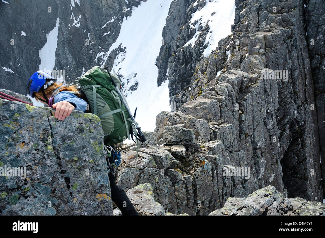 Climber on Tower Ridge, Ben Nevis, a classic route. She is near the