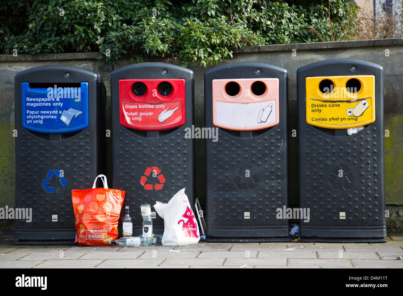 Recycling bins and abandoned rubbish. Let other people clear up after us attitude Stock Photo