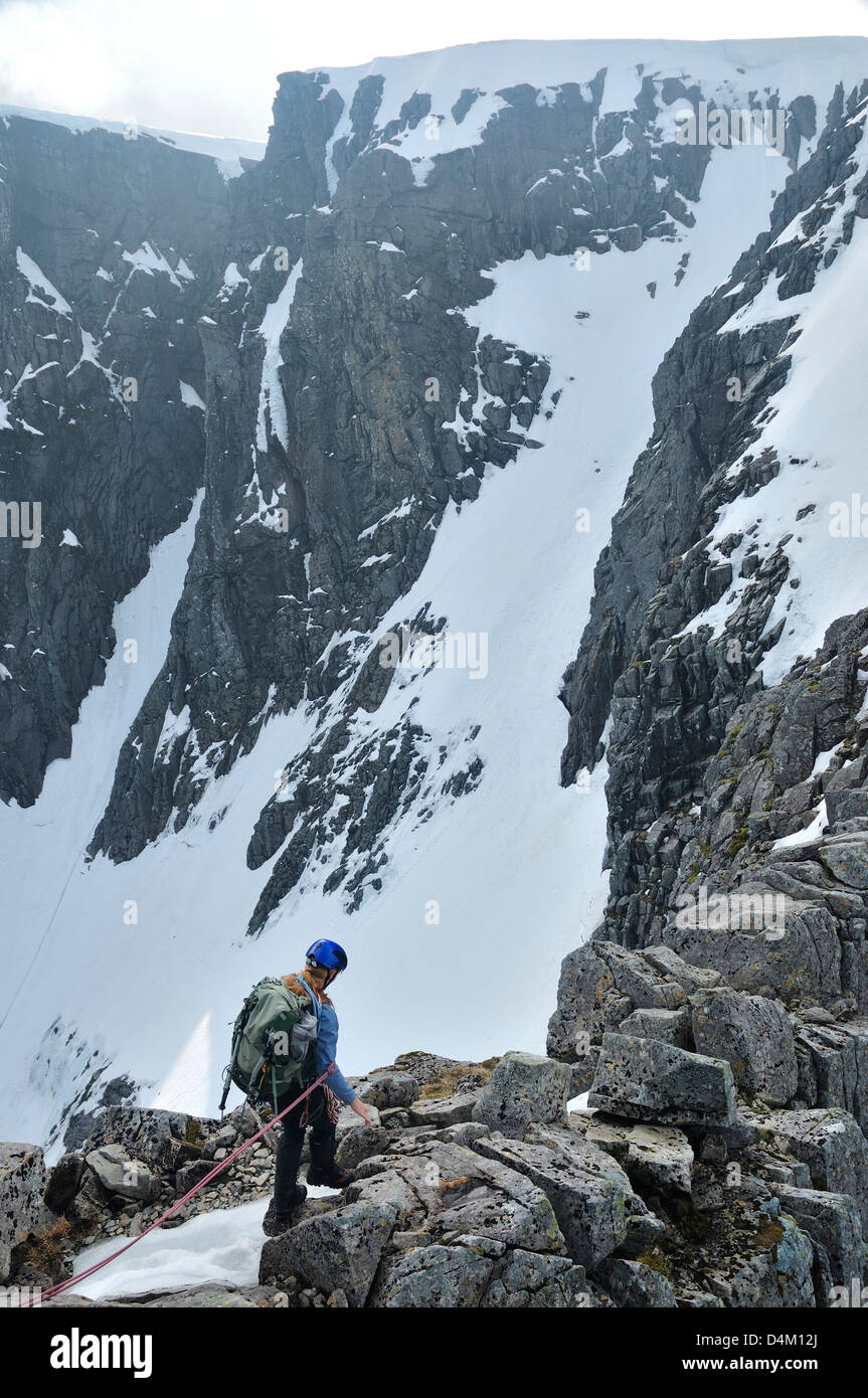 Climber on Tower Ridge, Ben Nevis, a classic route. She is near the