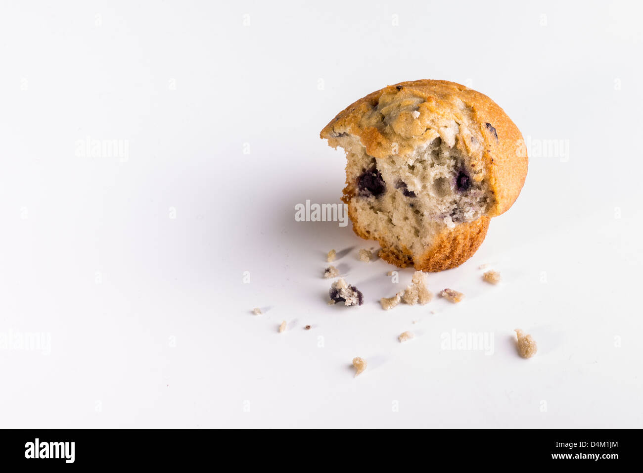 Blueberry Muffin with Bite Mark Stock Photo