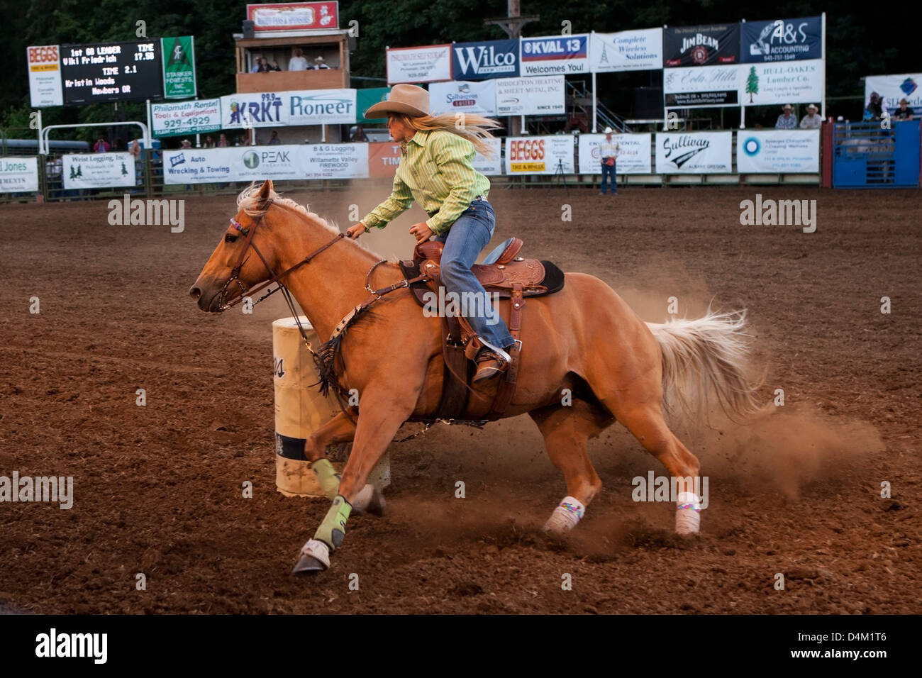 Woman riding horse at a rodeo show in Philomath, Oregon, USA. Stock Photo