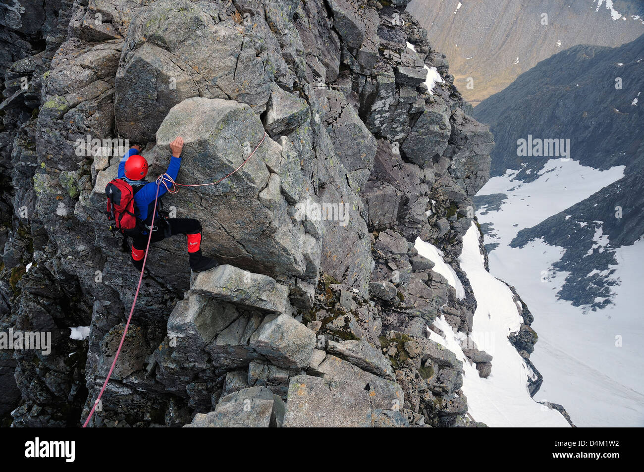 Climber crossing Tower Gap on Ben Nevis. A difficult section on a