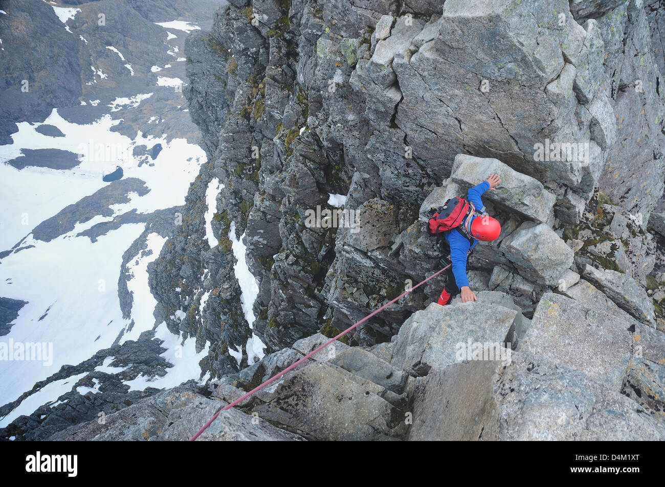 Climber crossing Tower Gap on Ben Nevis. A difficult section on a