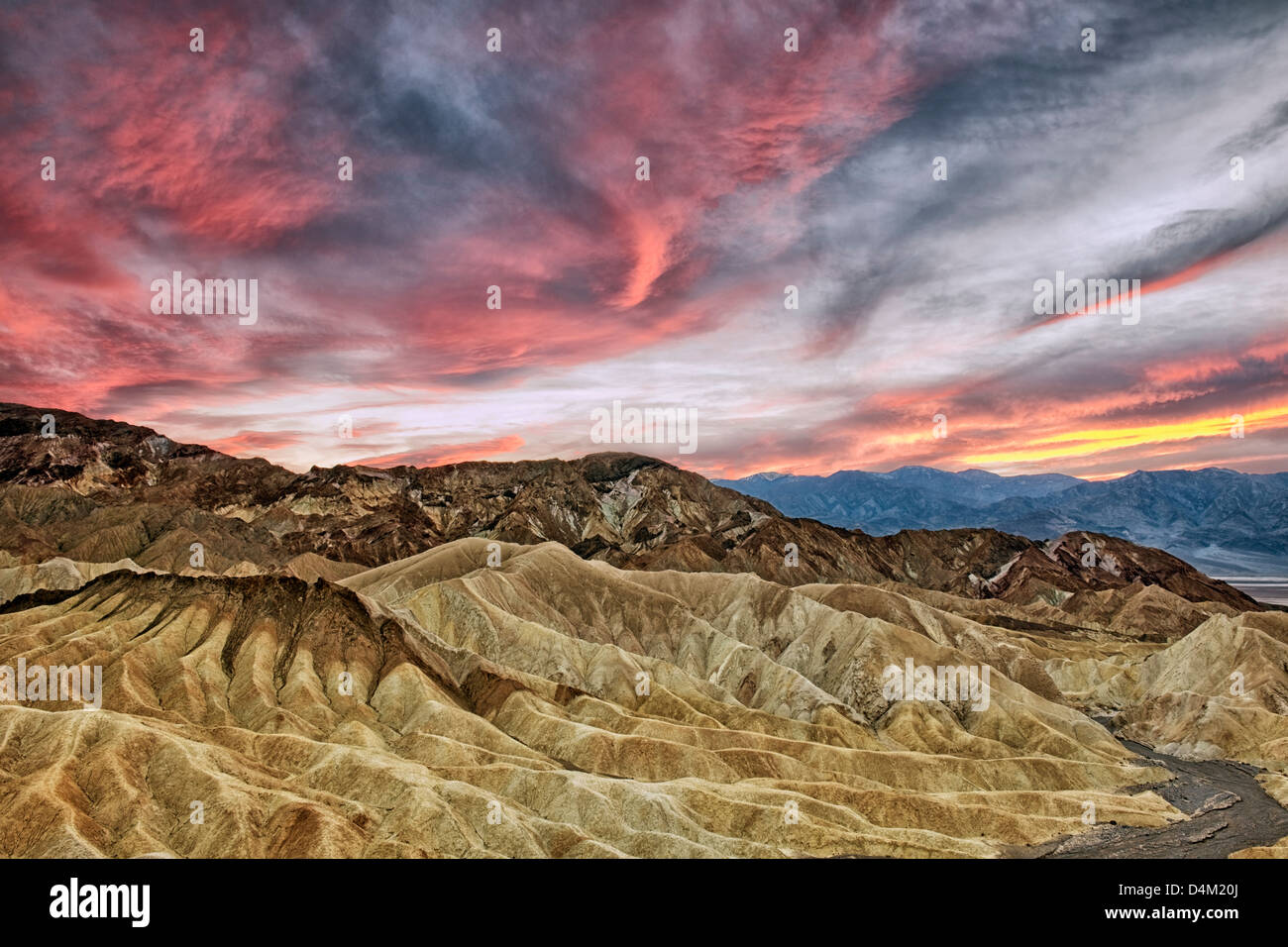 Spectacular sunset develops over Golden Canyon from Zabriskie Point and California's Death Valley National Park. Stock Photo