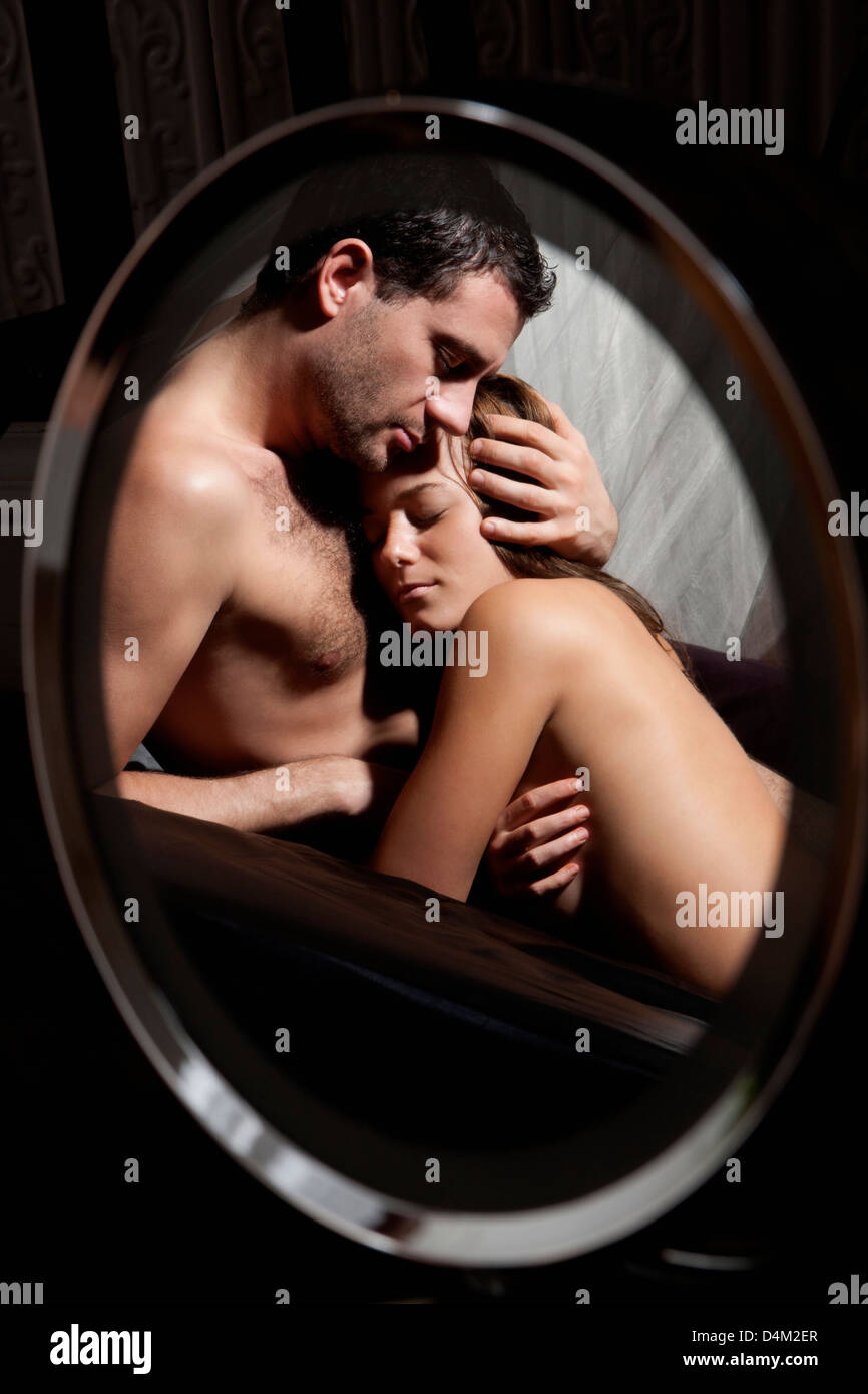 Nude couple hugging on bed Stock Photo - Alamy
