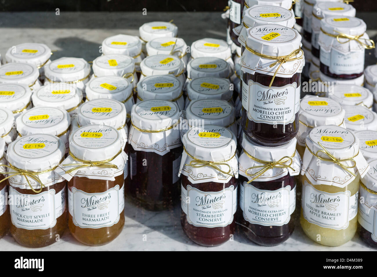Local jams and marmalades on display in a shop window in the town centre, Market Bosworth, Leicestershire, East Midlands, UK Stock Photo