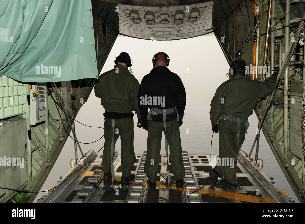 A Coast Guard HC-130 crew conducts a search and rescue exercise in the ...